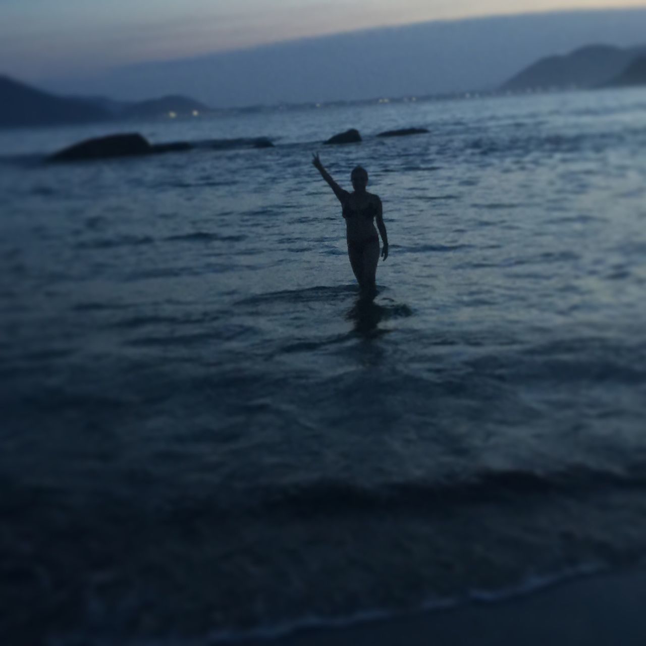 FULL LENGTH OF MAN ON SEA AGAINST SKY