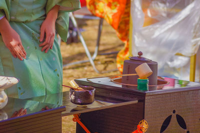 Midsection of man preparing food