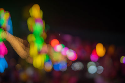 Defocused image of illuminated lights at night