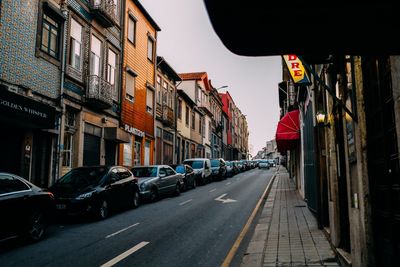 City street amidst buildings against sky