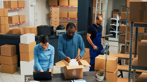 Rear view of business colleagues working at gym