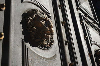 Low angle view of statue on door