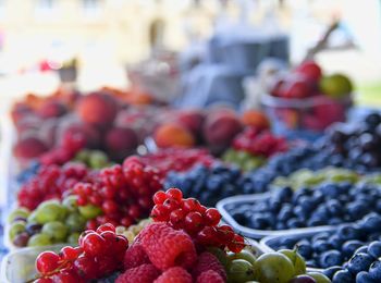 Red fruits for sale at market stall