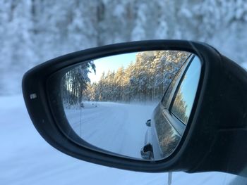 Reflection of car on side-view mirror