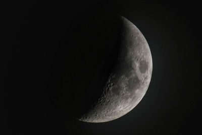 Low angle view of half moon against sky at night