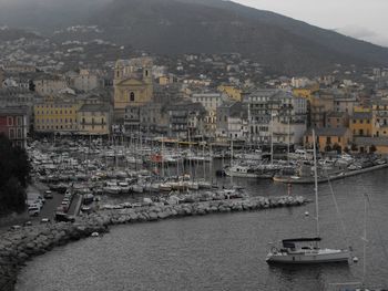 High angle view of townscape by sea