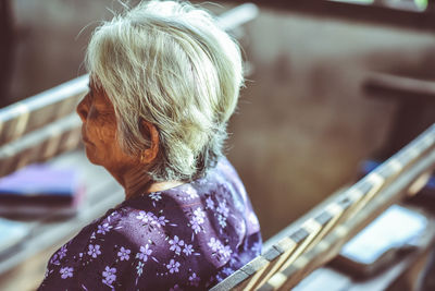 Rear view of woman playing outdoors