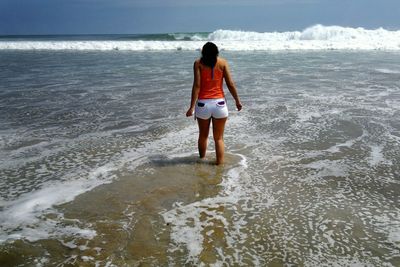 Woman standing on beach