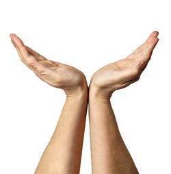 Close-up of hand against white background