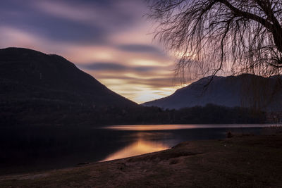 Scenic view of lake against sky during sunset