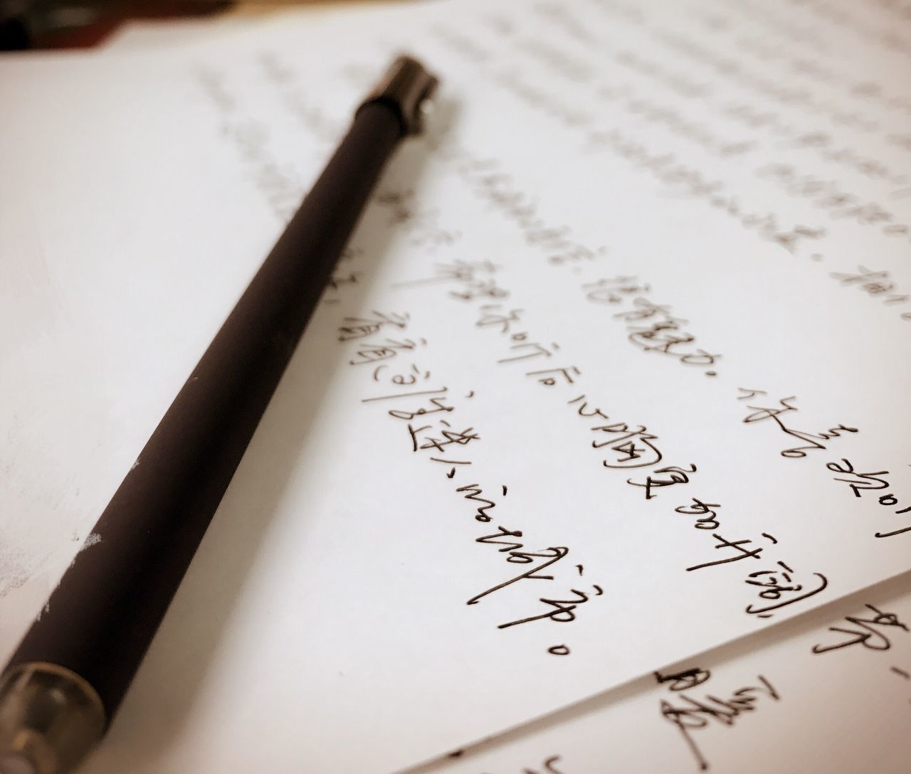 paper, education, close-up, high angle view, indoors, no people, old-fashioned, table, page, text, fountain pen, day