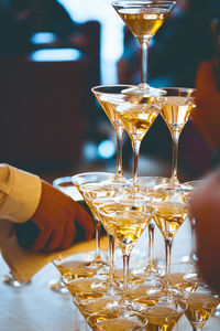 Midsection of wine in glass on table