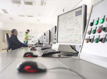 Rumania, woodworking, workers in monitoring center