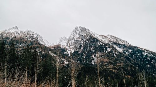 Scenic view of snowcapped mountains against clear sky