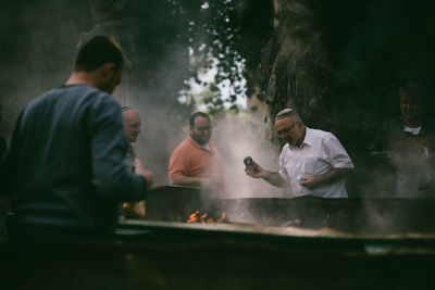 Group of people on barbecue grill