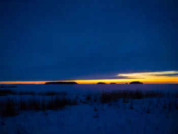 Scenic view of landscape against sky at night