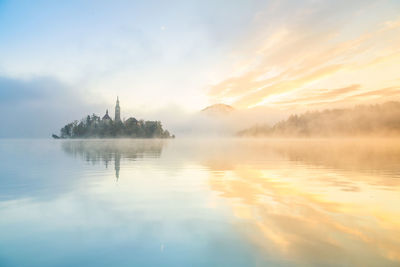 Panoramic view of lake against sky during sunset