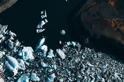 High angle view of icebergs near the shore