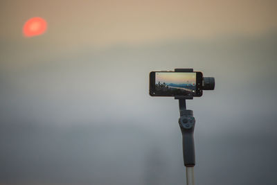 Low angle view of camera against sky