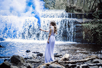 Woman standing in water