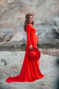 Portrait of young woman standing outdoors