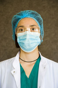 Woman doctors portrait, doctors with mask, glasses, glove and uniform. uniform 