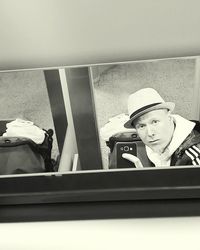 Reflection of woman in car mirror
