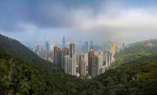 Panoramic view of buildings in city against sky