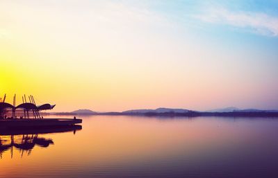 Scenic view of lake at sunset