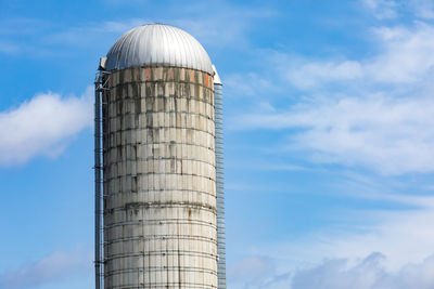 Low angle view of factory against sky