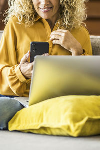 Young woman using laptop at home