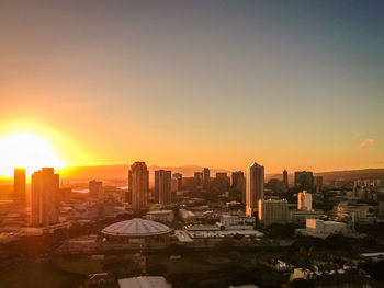 Cityscape against sky during sunset