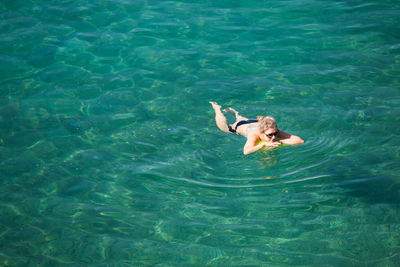 High angle view of man swimming in sea