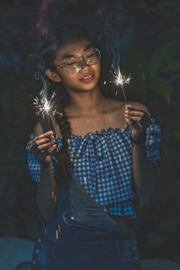 Young woman smiling in park