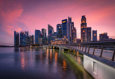 Illuminated city at waterfront