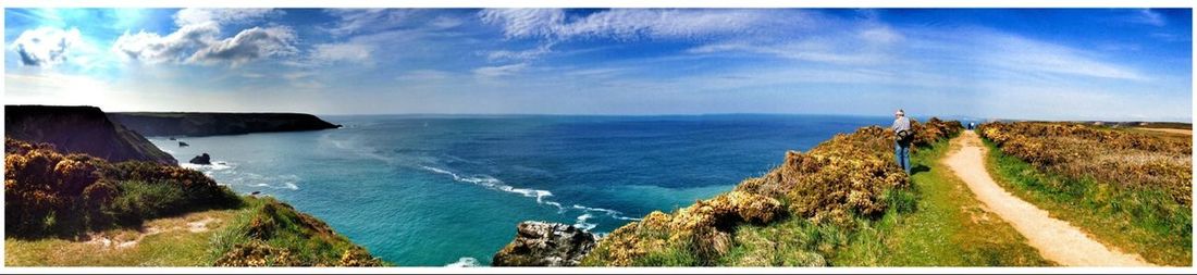 Scenic view of sea against cloudy sky