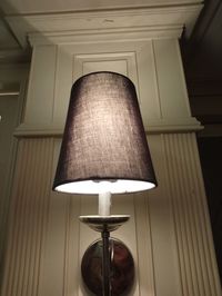 Low angle view of illuminated lamp at home