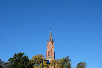 Low angle view of church against clear blue sky