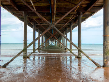 Pier over sea against sky