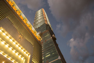 Low angle view of illuminated buildings against sky