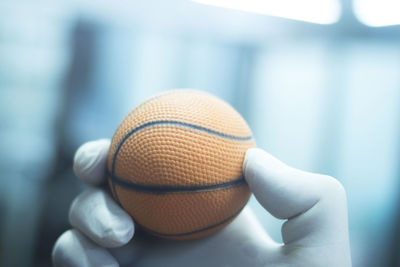 Close-up of hand holding ball