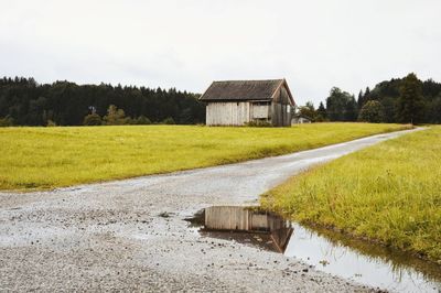 House on field against sky