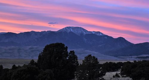 Scenic view of mountains against sky during sunset