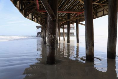 Pier over sea against sky