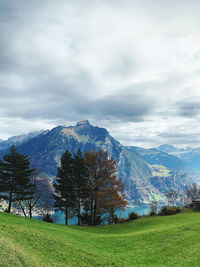 Scenic view of landscape and mountains against sky