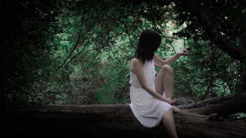 Woman sitting in a forest