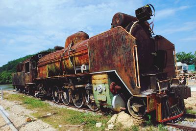 Abandoned train against sky