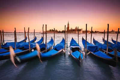 Boats moored in canal