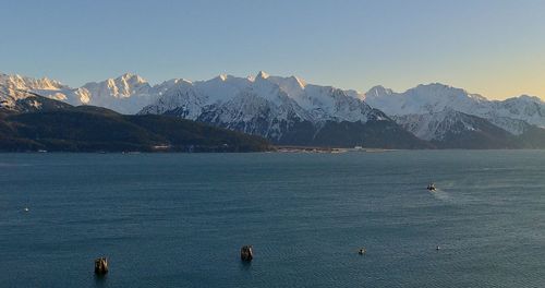 Scenic view of snowcapped mountains against sky