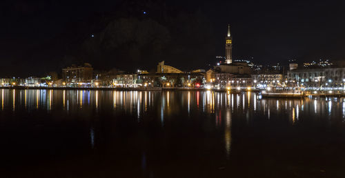 The long lake of lecco illuminated at night